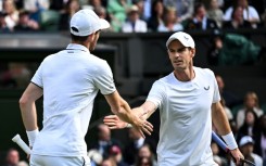 End of the road: Britain's Andy Murray (R) with brother Jamie Murray in action at Wimbledon this year