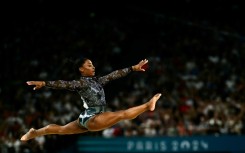 Simone Biles competes in floor exercise in women's gymnastics qualifying at the Paris Olympics