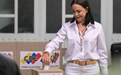 Venezuelan President Nicolas Maduro (L) and opposition candidate Edmundo Gonzalez Urrutia cast their votes in Caracas -- the presidential election is taking place amid high tension and official attacks on Gonzalez Urrutia