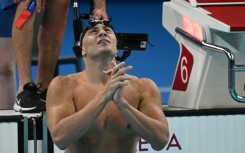 Italy's Nicolo Martinenghi celebrates after winning men's 100m breaststroke gold at the Paris Olympics