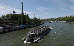 A tourist boat on the Seine river in Paris which is due to hold the swimming event in the Olympic triathlon