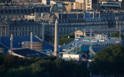 The venues of the Olympic Urban Park arranged round the  Luxor Obelisk at La Concorde seen from the Eiffel Tower