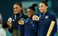 Brazil's Rebeca Andrade and Americans Simone Biles and Sunisa Lee pose with their Olympic gymnastics all-around medals