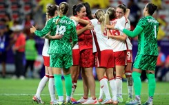 Canada's players celebrate after beating Colombia to qualify for the quarter-finals at the Olympics