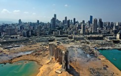 An aerial view on August 5, 2020 of the massive damage to Beirut port's grain silos (C) and surrounding area after a blast tore through the harbour in the heart of the Lebanese capital