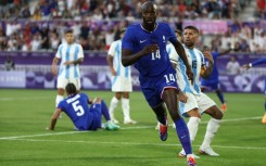 Jean-Philippe Mateta runs away in celebration after scoring for France against Argentina