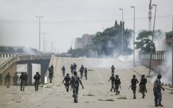 Nigerian security forces fire tear gas during the protests in Abuja