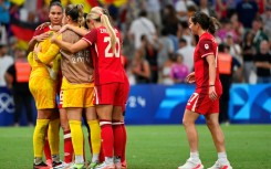 Canada players react after their penalty shoot-out defeat at the hands of Germany in Marseille