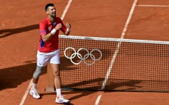 Serbia's Novak Djokovic celebrates becoming Olympic champion