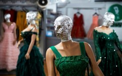 To comply with the Taliban government's edict, shopkeepers in Kabul hide the mannequins' faces in foil