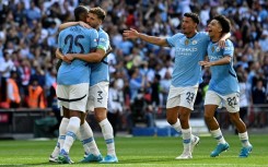 Manuel Akanji (left) scored the winning penalty as Manchester City beat Manchester United in the Community Shield