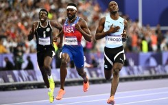 Letsile Tebogo crosses the line after winning the Olympic men's 200m with ease