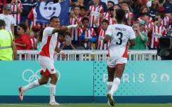 Soufiane Rahimi (L) celebrates scoring Morocco's fourth goal as they hammered Egypt 6-0 on Thursday to take Olympic men's football bronze 