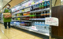 A sign telling customers the sale of water is rationed at a supermarket in Sumida district of Tokyo