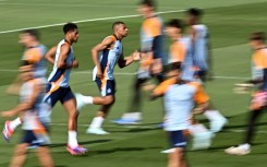 Real Madrid's French forward Kylian Mbappe (C) trained Saturday ahead of his likely La Liga debut against Mallorca 