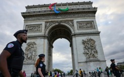 The symbol of the Paralympic movement adorns the Arc de Triomphe