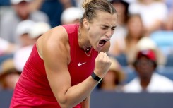 Third-ranked Aryna Sabalenka of Belarus celebrated winning match point against top-ranked Iga Swiatek of Poland in a WTA Cincinnati Open semi-final