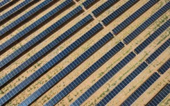 An aerial view shows solar panels at the fishing-solar complementary photovoltaic power generation base in Lianyungang, in eastern China's Jiangsu province