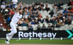 Success: England's Chris Woakes celebrates bowling out Sri Lanka's Nishan Madushka in the first Test at Old Trafford