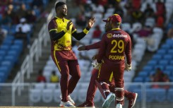 Romario Shepherd of West Indies celebrates the dismissal of Reeza Hendricks of South Africa during the 2nd T20I match at Brian Lara Cricket Academy on Sunday