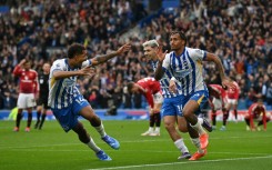 Brighton's Joao Pedro (R) celebrates scoring the winner against Manchester United