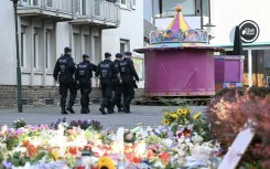 German police patrol after a knife attack that has added to a bitter debate over immigration