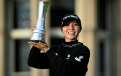 Victory joy: New Zealand's Lydia Ko poses with the trophy after winning the Women's British Open Golf Championship, on the Old Course at St Andrews