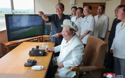 A Korean Central News Agency photo from August 26 shows North Korean leader Kim Jong Un inspecting a  test of drones at an undisclosed location in North Korea