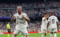 Real Madrid's Uruguayan midfielder Federico Valverde celebrates scoring the opening goal against Valladolid