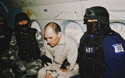 Osiel Cardenas Guillen in custody of Mexican agents during his extradition to the United States in 2007