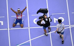 US sprinter Jaydin Blackwell celebrates after winning his country's first track and field gold medal of the Paris Paralympics