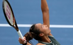 Zheng Qinwen serves in her US Open victory over Jule Niemeier