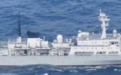 A handout picture taken on August 31 and released September 1 by Japan's Ministry of Defense Joint Staff Office shows a Chinese naval survey vessel entering Japanese territorial waters off Yakushima Island