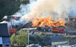 Firefighters tackle a blaze at a Think Pink landfill site at Botkyrka, south of Stockholm