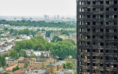 A first report by a public inquiry into the 2017 tragedy laid the bulk of the blame for the fire's rapid spread across the building on its highly flammable cladding