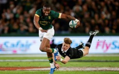 New Zealand's Damian McKenzie (R) tackles South Africa's Aphelele Fassi during their Rugby Championship match last week