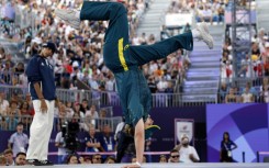 Australia's Rachael Gunn (R), known as Raygun, competes against France's Sya Dembele, known as Syssy, in the Olympic breaking