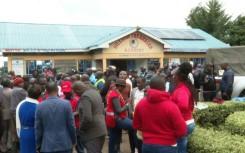 Parents gather outside Kenya primary school after fire kills 17 children