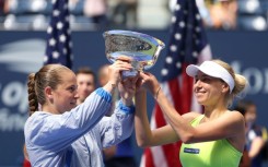 Champions: Bride-to-be Lyudmyla Kichenok (R) with Jelena Ostapenko pose with their trophy 