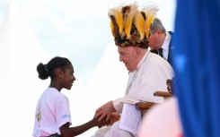 The pope's Asia-Pacific tour included a stop in Papua New Guinea, where he donned a traditional headdress