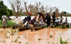 In Niger, people were forced to use canoes after heavy rains damaged main roads