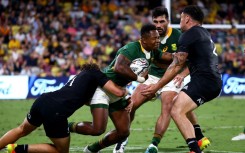 South Africa winger Sibusiso Nkosi (C) is tackled in a 2021 Rugby Championship match against New Zealand.
