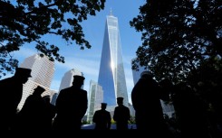 People look at the names of victims on the South Tower Memorial Pool during  during the 23rd anniversary of the September 11 terror attack on the World Trade Center at Ground Zero, in New York City on September 11, 2024.