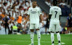 Real Madrid coach Carlo Ancelotti said strikers Kylian Mbappe (L) and Vinicius Junior (R) are "training well, happy" after an underwhelming start to the season