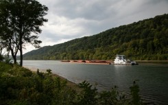 A coal barge is seen along the Monongahela River in Monongahela, Washington County