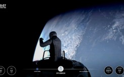 Jared Isaacman swung open the hatch and climbed out into the void, gripping a structure called 'Skywalker' as a breathtaking view of Earth unfolded before him 