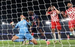 Girona goalkeeper Paulo Gazzaniga (L) made a costly error in the final minute to gift PSG victory 