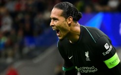 Liverpool defender Virgil van Dijk celebrates scoring against AC Milan