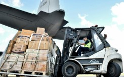 A shipment of emergency medical aid provided by Iraq is unloaded at Beirut International Airport