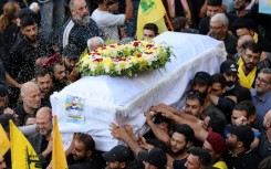 Mourners in Beirut pay respects to a person killed when hundreds of paging devices exploded across Lebanon the day before